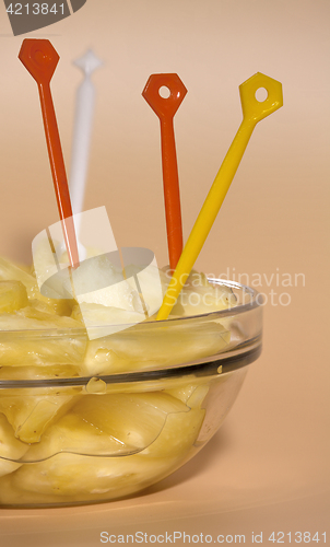 Image of  cup filled with pineapple slices 