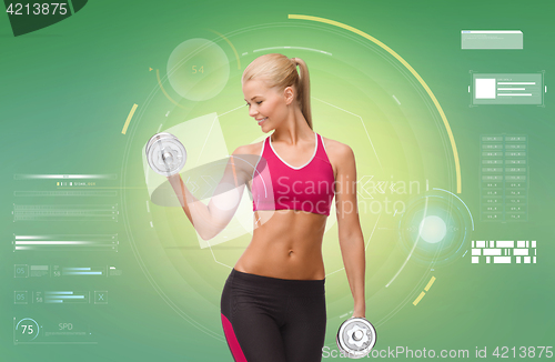 Image of happy sporty woman with dumbbells flexing biceps