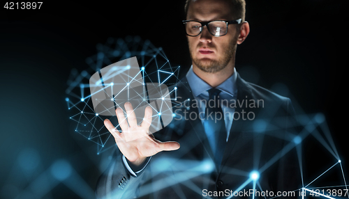 Image of businessman touching virtual projection