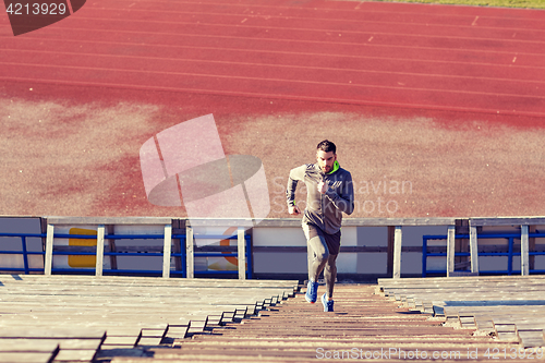 Image of man running upstairs on stadium