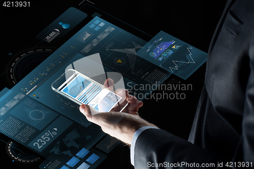 Image of close up of businessman with charts on smartphone
