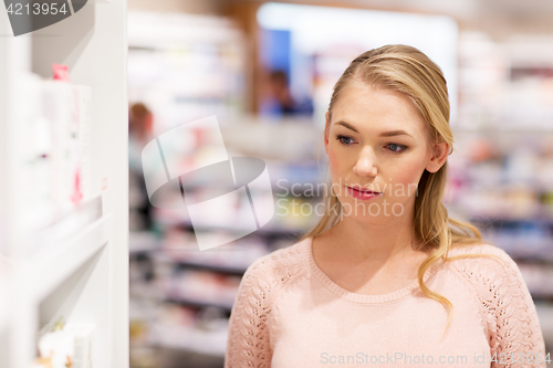 Image of young woman at pharmacy