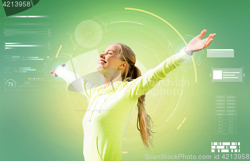 Image of happy woman doing sports and enjoying sunlight