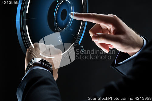 Image of close up of businessman hands with smartwatch