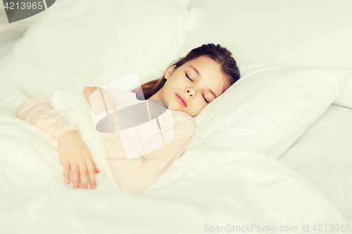 Image of girl sleeping in bed at home