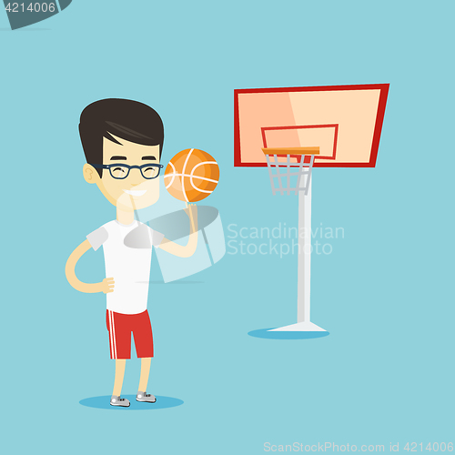 Image of Young basketball player spinning ball.