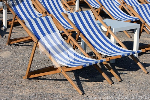 Image of blue and white chaise longues