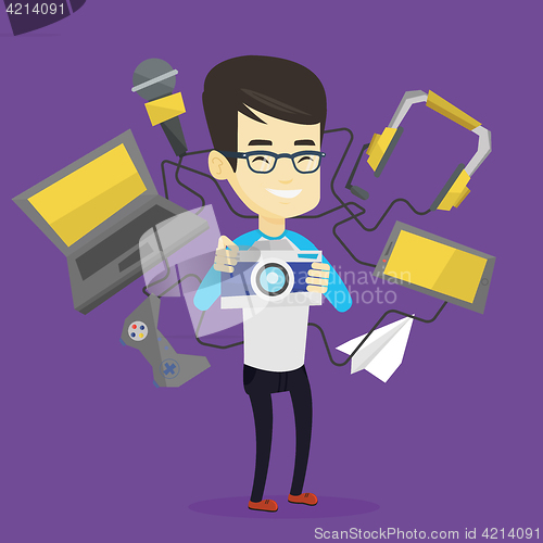 Image of Young man surrounded with his gadgets.