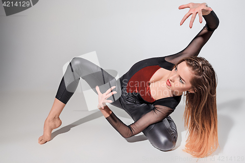 Image of The woman dancing on gray