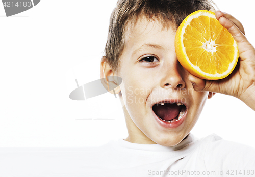 Image of little cute boy with orange fruit double isolated on white smili