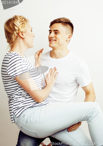 Image of young pretty teenage couple, hipster guy with his girlfriend happy smiling and hugging isolated on white background, lifestyle people concept