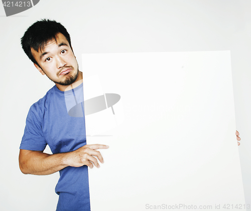 Image of pretty cool asian man holding empty white plate smiling