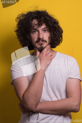 Image of young man with funny hair over color background