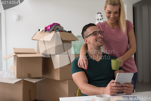 Image of Young couple moving in a new home