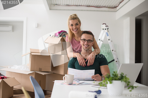 Image of Young couple moving in a new home