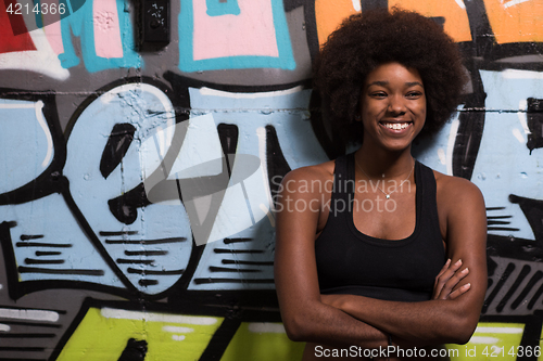 Image of black woman after a workout at the gym