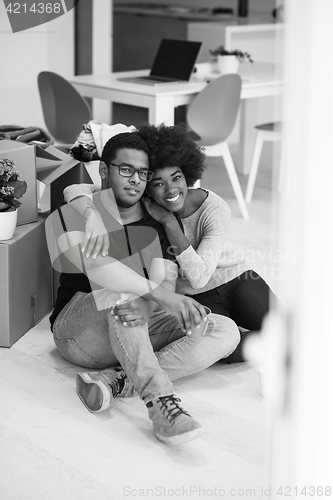 Image of African American couple relaxing in new house