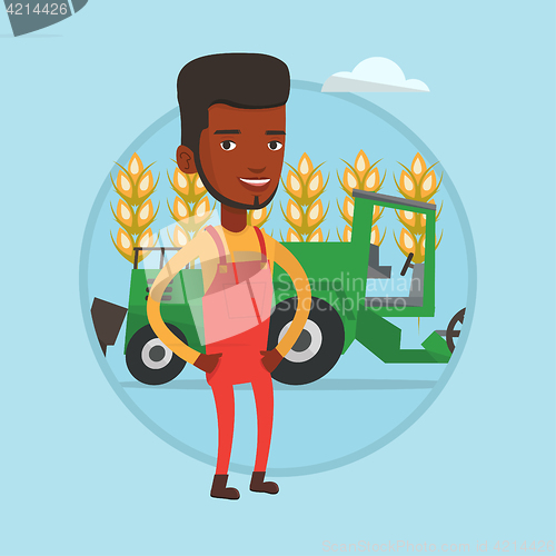 Image of Farmer standing with combine on background.