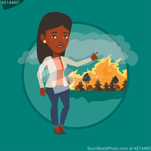 Image of Woman standing on background of wildfire.