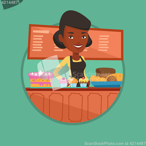 Image of Worker standing at the counter at the bakery.