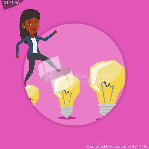 Image of Business woman jumping on light bulbs.