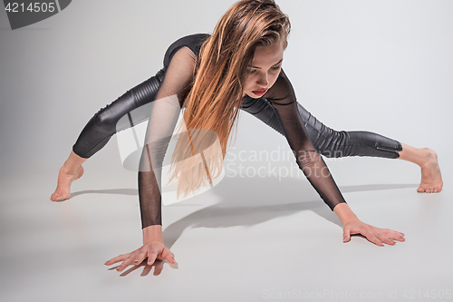 Image of The woman dancing on gray