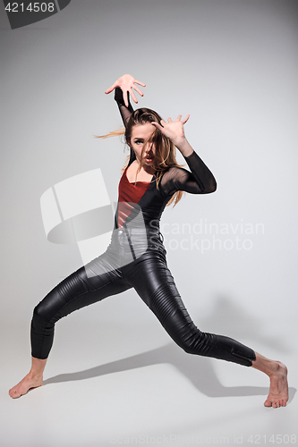 Image of The woman dancing on gray