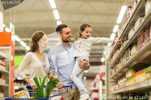 Image of family with food in shopping cart at grocery store