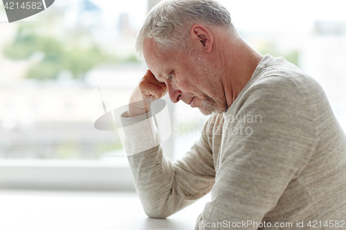 Image of close up of senior man thinking