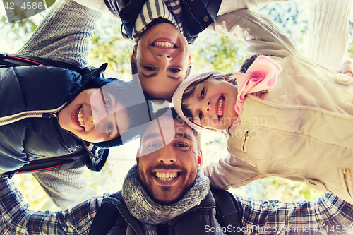 Image of happy family faces outdoors at camp in woods