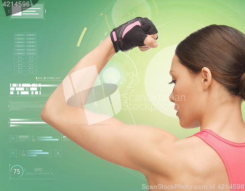 Image of close up of sporty woman showing biceps