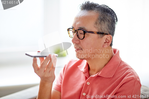 Image of man using voice command recorder on smartphone