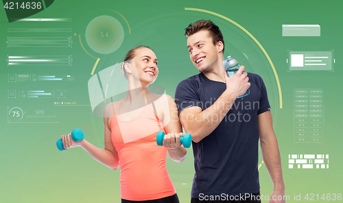 Image of sportive man and woman with dumbbells and water