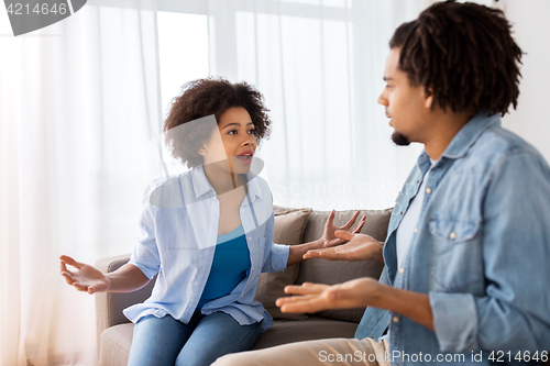 Image of unhappy couple having argument at home