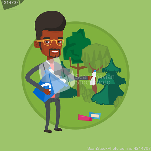 Image of Man collecting garbage in forest.