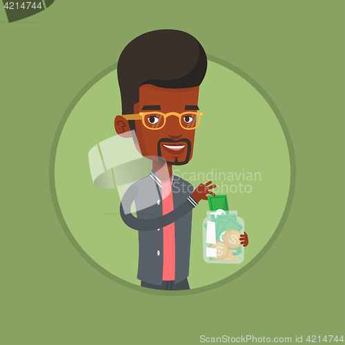 Image of Business man putting dollar into money box.