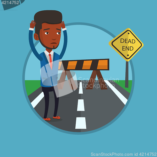 Image of Businessman looking at road sign dead end.