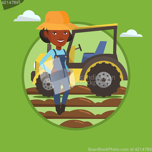 Image of Farmer standing with tractor on background.