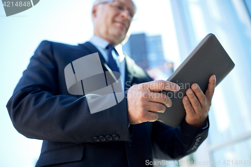 Image of businessman with tablet pc outdoors