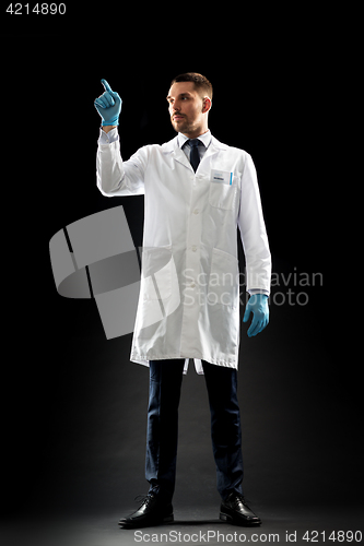 Image of doctor or scientist in lab coat and medical gloves