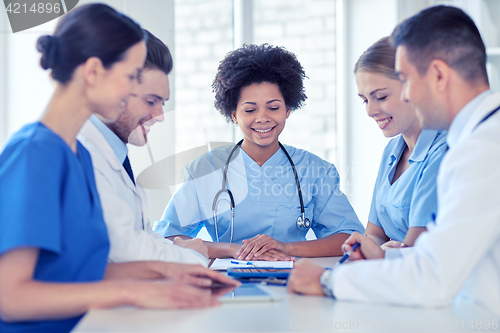 Image of group of happy doctors meeting at hospital office