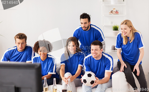 Image of friends or football fans watching soccer at home