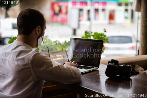 Image of Photographer working on a laptop