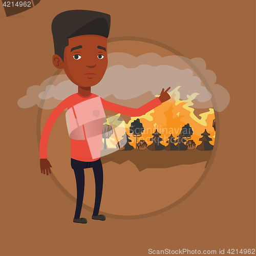Image of Man standing on background of forest fire.