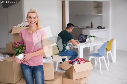 Image of young couple moving into a new home