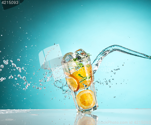 Image of The rose exotic cocktail and fruit on blue