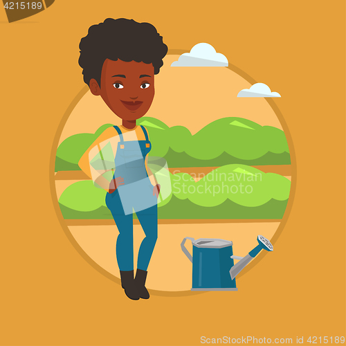 Image of Farmer with watering can at field.