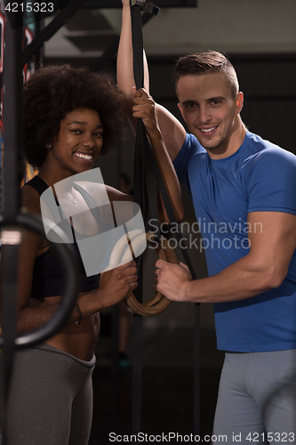 Image of Portrait of multiethnic couple  after workout at gym