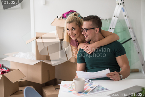 Image of Young couple moving in a new home