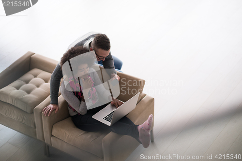 Image of multiethnic couple shopping online